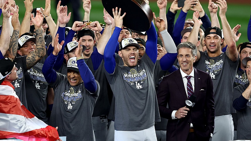 Oct 31, 2024; New York, New York, USA; Los Angeles Dodgers first baseman Freddie Freeman (5) accepts the Willie Mays World Series Most Valuable Player trophy after winning the 2024 MLB World Series against the New York Yankees at Yankee Stadium. Mandatory Credit: Vincent Carchietta-Imagn Images