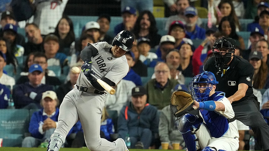 Oct 26, 2024; Los Angeles, California, USA; New York Yankees outfielder Juan Soto (22) hits a single against the Los Angeles Dodgers in the ninth inning for game two of the 2024 MLB World Series at Dodger Stadium. Mandatory Credit: Kirby Lee-Imagn Images