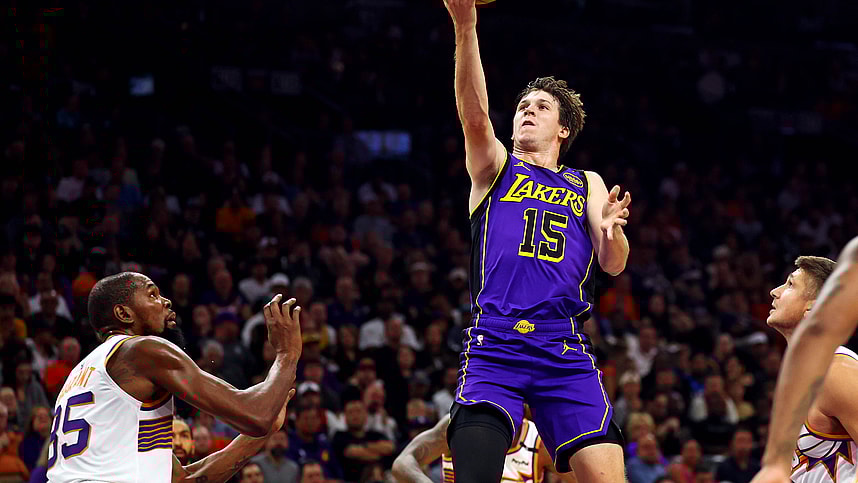 Oct 28, 2024; Phoenix, Arizona, USA; Los Angeles Lakers guard Austin Reaves (15) shoots the ball against Phoenix Suns forward Kevin Durant (35) during the first quarter at Footprint Center. Mandatory Credit: Mark J. Rebilas-Imagn Images