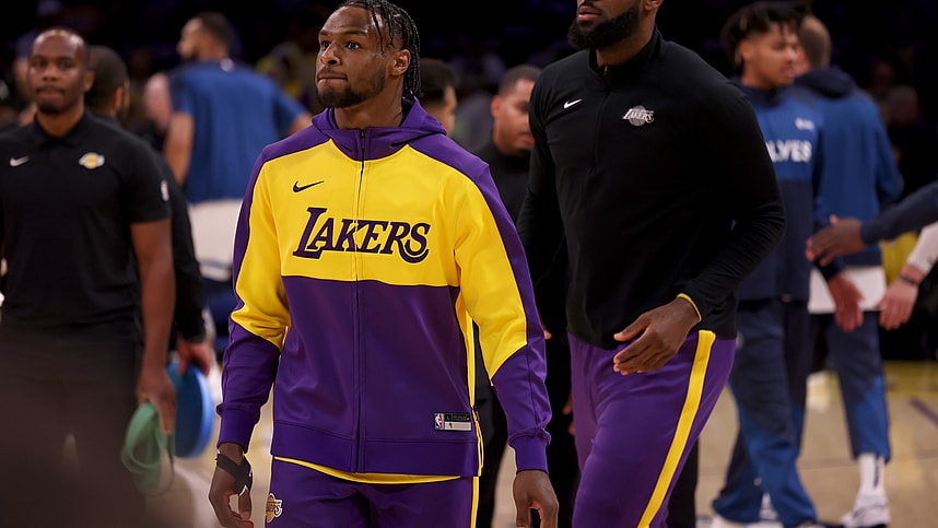 Oct 22, 2024; Los Angeles, California, USA; Los Angeles Lakers guard Bronny James (9) and forward LeBron James (23) warm up before a game against the Minnesota Timberwolves at Crypto.com Arena. Mandatory Credit: Jason Parkhurst-Imagn Images