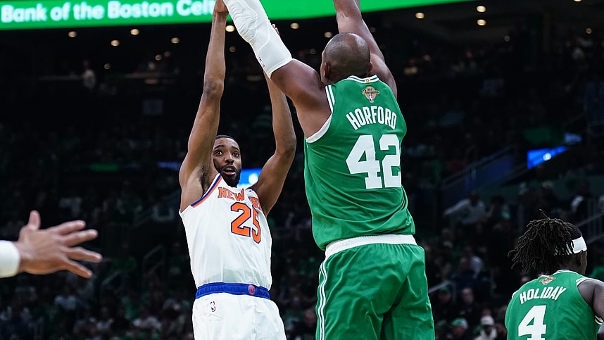 Oct 22, 2024; Boston, Massachusetts, USA; New York Knicks forward Mikal Bridges (25) shoots against Boston Celtics center Al Horford (42) in the second half at TD Garden. Mandatory Credit: David Butler II-Imagn Images