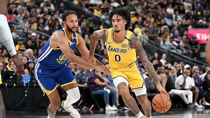 Oct 15, 2024; Las Vegas, Nevada, USA; Los Angeles Lakers guard Jalen Hood-Schifino (0) drives past Golden State Warriors forward Kyle Anderson (1) in the third quarter during a preseason game at T-Mobile Arena. Mandatory Credit: Candice Ward-Imagn Images