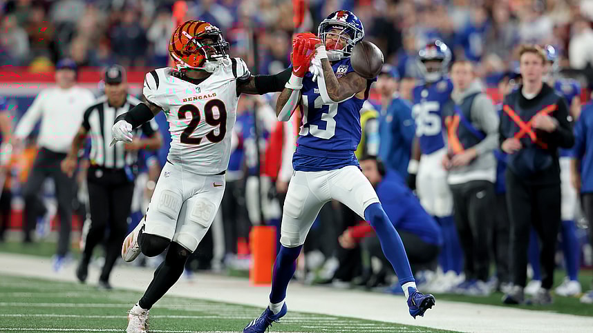 Oct 13, 2024; East Rutherford, New Jersey, USA; Cincinnati Bengals cornerback Cam Taylor-Britt (29) breaks up a pass intended for New York Giants wide receiver Jalin Hyatt (13) during the fourth quarter at MetLife Stadium. Mandatory Credit: Brad Penner-Imagn Images