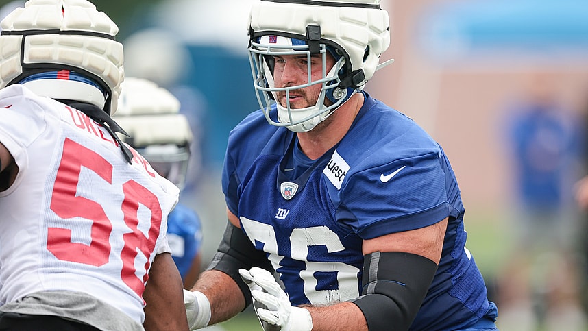 Jul 24, 2024; East Rutherford, NJ, USA; New York Giants guard Jon Runyan (76) blocks linebacker Bobby Okereke (58) during training camp at Quest Diagnostics Training Facility. Mandatory Credit: Vincent Carchietta-Imagn Images