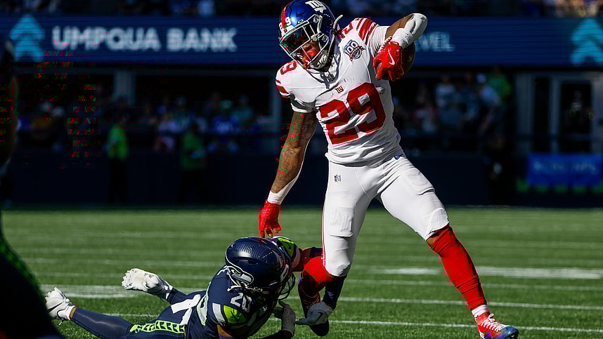Oct 6, 2024; Seattle, Washington, USA; New York Giants running back Tyrone Tracy Jr. (29) breaks a tackle attempt by Seattle Seahawks safety Julian Love (20) during the second quarter at Lumen Field. Mandatory Credit: Joe Nicholson-Imagn Images