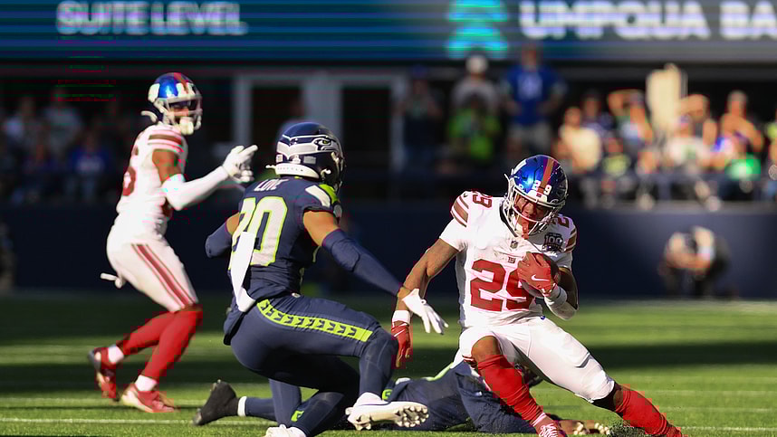 Oct 6, 2024; Seattle, Washington, USA; New York Giants running back Tyrone Tracy Jr. (29) carries the ball against the Seattle Seahawks during the second half at Lumen Field. Mandatory Credit: Steven Bisig-Imagn Images
