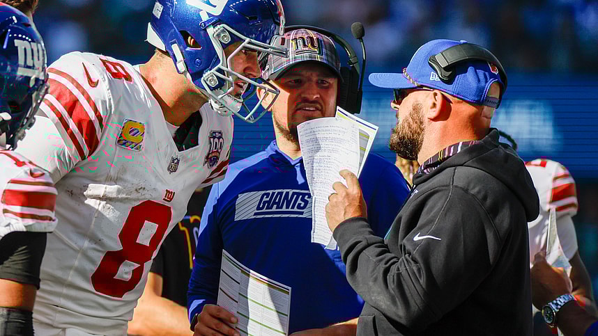 Oct 6, 2024; Seattle, Washington, USA; New York Giants quarterback Daniel Jones (8) talks with head coach Brian Daboll, right) during the second quarter against the Seattle Seahawks at Lumen Field. New York Giants quarterbacks coach Shea Tierney stands in the middle. Mandatory Credit: Joe Nicholson-Imagn Images