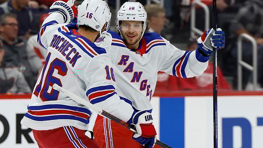 Oct 17, 2024; Detroit, Michigan, USA; New York Rangers left wing Artemi Panarin (10) receives congratulations from teammates after scoring in the first period against the Detroit Red Wings at Little Caesars Arena. Mandatory Credit: Rick Osentoski-Imagn Images