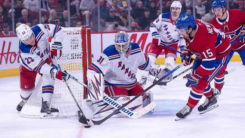 Oct 22, 2024; Ottawa, Ontario, CAN; New York Rangers defenseman Adam Fox (23) battles with Montreal Canadiens center Alex Newhook (15) for control of the puck in the second period at the Bell Centre. Mandatory Credit: Marc DesRosiers-Imagn Images
