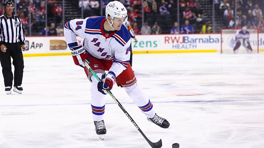 Sep 30, 2024; Newark, New Jersey, USA; New York Rangers center Adam Edstrom (84) skates with the puck against the New Jersey Devils during the first period at Prudential Center. Mandatory Credit: Ed Mulholland-Imagn Images