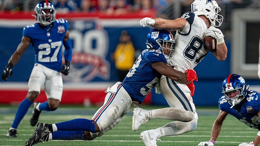 Sep 26, 2024; East Rutherford, NJ, US; Dallas Cowboys tight end Jake Ferguson (87) is taken down after catching a pass by New York Giants linebacker Bobby Okereke (58) at MetLife Stadium. Mandatory Credit: Julian Guadalupe-NorthJersey.com