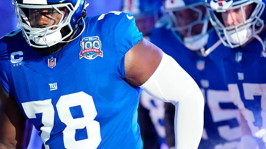 New York Giants offensive tackle Andrew Thomas (78) and his teammates run onto the field moments before kickoff, Sunday, October 13, 2024, in East Rutherford.