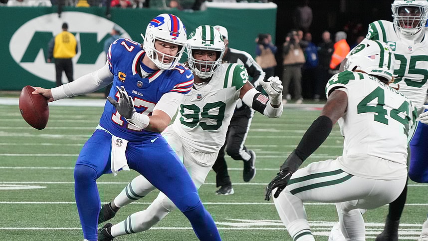 East Rutherford, NJ -- October 14, 2024 -- Josh Allen of Buffalo tries to avoid Jamien Sherwood of the Jets in the first half. The Buffalo Bills came to MetLife Stadium to play the NY Jets. The Jets played their first game under new interim head coach Jeff Ulbrich.
