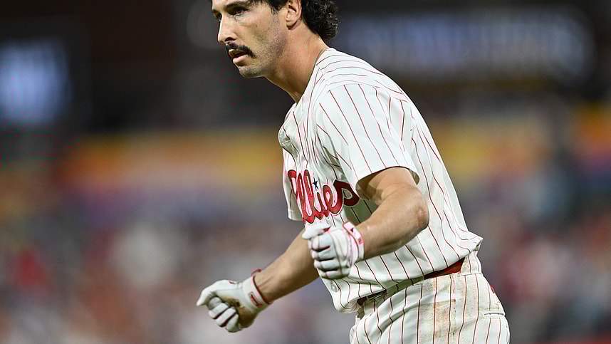 Sep 24, 2024; Philadelphia, Pennsylvania, USA; Philadelphia Phillies catcher Garrett Stubbs (21) reacts after reaching first base safely on an RBI bunt against the Chicago Cubs in the second inning at Citizens Bank Park. Mandatory Credit: Kyle Ross-Imagn Images