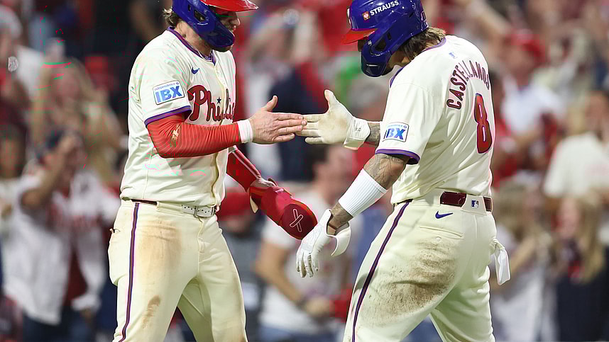 Oct 6, 2024; Philadelphia, Pennsylvania, USA; Philadelphia Phillies outfielder Nick Castellanos (8) and first base Bryce Harper (3) celebrate after scoring a run in the eighth inning against the New York Mets during game two of the NLDS for the 2024 MLB Playoffs at Citizens Bank Park. Mandatory Credit: Bill Streicher-Imagn Images
