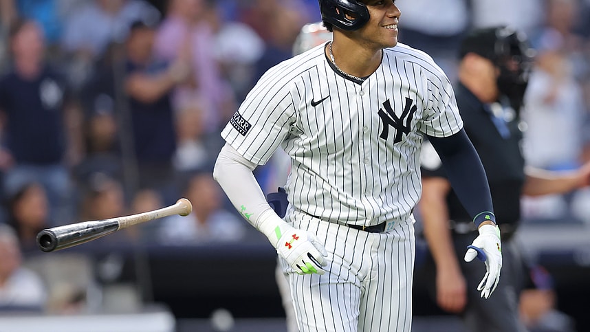 Jul 24, 2024; Bronx, New York, USA; New York Yankees right fielder Juan Soto (22) flips his bat after hitting a solo home run against the New York Mets during the third inning at Yankee Stadium. Mandatory Credit: Brad Penner-Imagn Images