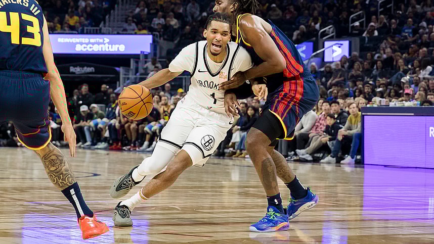 Nov 25, 2024; San Francisco, California, USA; Golden State Warriors forward Kevon Looney (5) defen3ds Brooklyn Nets forward Ziaire Williams (1) during the first half at Chase Center. Mandatory Credit: John Hefti-Imagn Images