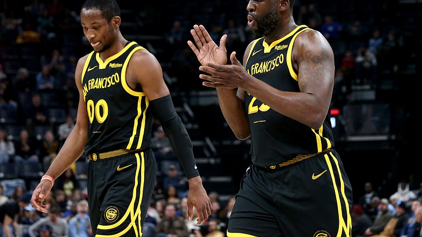 Jan 15, 2024; Memphis, Tennessee, USA; Golden State Warriors forward Jonathan Kuminga (00) and Golden State Warriors forward Draymond Green (23) walk to the bench at the end of the first quarter against the Memphis Grizzlies at FedExForum. Mandatory Credit: Petre Thomas-Imagn Images