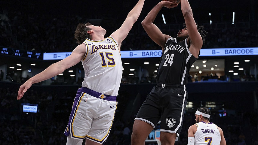 Mar 31, 2024; Brooklyn, New York, USA; Brooklyn Nets guard Cam Thomas (24) shoots the ball against Los Angeles Lakers guard Austin Reaves (15) during the first half at Barclays Center. Mandatory Credit: Vincent Carchietta-Imagn Images