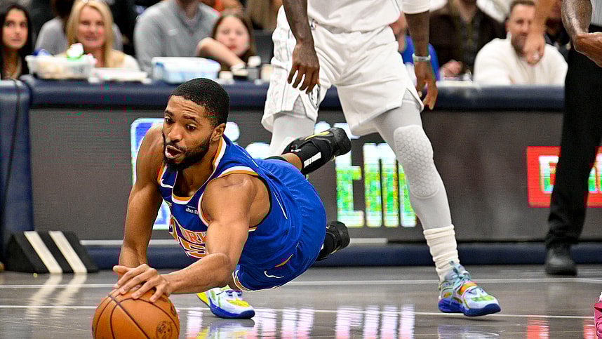 Nov 27, 2024; Dallas, Texas, USA; New York Knicks forward Mikal Bridges (25) dives for the ball during the first quarter against the Dallas Mavericks at the American Airlines Center. Mandatory Credit: Jerome Miron-Imagn Images