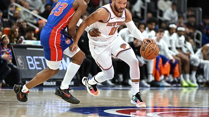 Nov 1, 2024; Detroit, Michigan, USA; New York Knicks guard Jalen Brunson (11) drive past Detroit Pistons guard Jaden Ivey (23) in the third quarter at Little Caesars Arena. Mandatory Credit: Lon Horwedel-Imagn Images