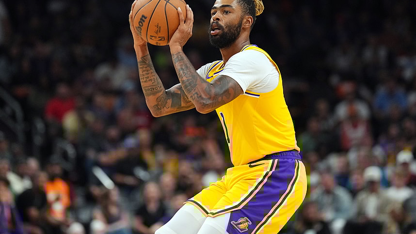 Oct 17, 2024; Phoenix, Arizona, USA; Los Angeles Lakers guard D'Angelo Russell (1) shoots against the Phoenix Suns during the second half at Footprint Center. Mandatory Credit: Joe Camporeale-Imagn Images