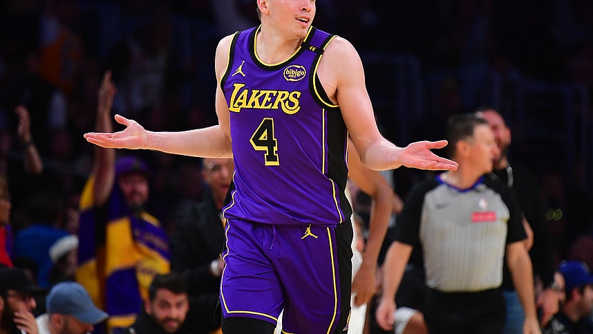 Nov 19, 2024; Los Angeles, California, USA; Los Angeles Lakers guard Dalton Knecht (4) react after scoring a three point basket against the Utah Jazz during the second half at Crypto.com Arena. Mandatory Credit: Gary A. Vasquez-Imagn Images