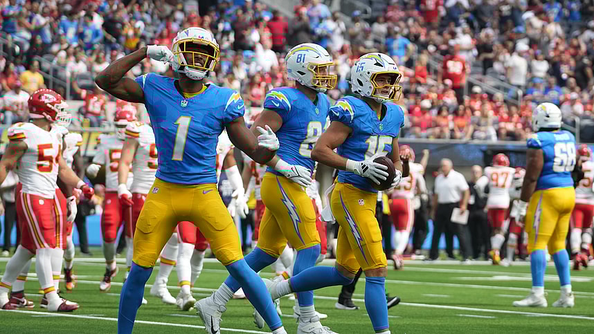 Sep 29, 2024; Inglewood, California, USA; Los Angeles Chargers wide receiver Ladd McConkey (15) celebrates with wide receiver Quentin Johnston (1) and ight end Will Dissly (81) after catching a 7-yard touchdown pass against the Kansas City Chiefs in the first quarter at SoFi Stadium. Mandatory Credit: Kirby Lee-Imagn Images