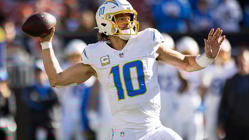 Nov 3, 2024; Cleveland, Ohio, USA; Los Angeles Chargers quarterback Justin Herbert (10) throws the ball against the Cleveland Browns during the second quarter at Huntington Bank Field. Mandatory Credit: Scott Galvin-Imagn Images