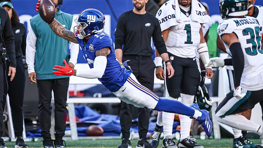 Oct 20, 2024; East Rutherford, New Jersey, USA; New York Giants wide receiver Jalin Hyatt (13) attempts to catch a pass in front of Philadelphia Eagles safety Tristin McCollum (36) during the second half at MetLife Stadium. Mandatory Credit: Vincent Carchietta-Imagn Images