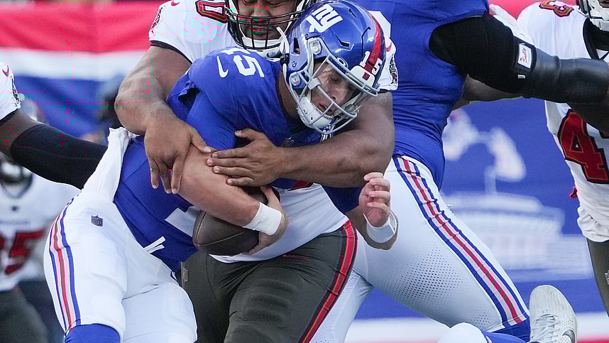 Nov 24, 2024; East Rutherford, New Jersey, USA; New York Giants quarterback Tommy DeVito (15) is sacked by Tampa Bay Buccaneers defensive tackle Vita Vea (50) during the first half at MetLife Stadium. Mandatory Credit: Robert Deutsch-Imagn Images