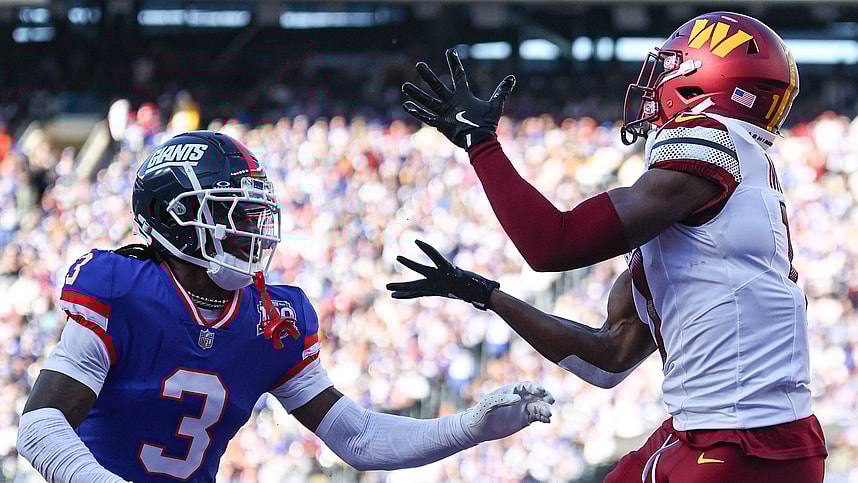 Nov 3, 2024; East Rutherford, New Jersey, USA; Washington Commanders wide receiver Terry McLaurin (17) catches a touchdown pass as New York Giants cornerback Deonte Banks (3) defends during the first half at MetLife Stadium. Mandatory Credit: Vincent Carchietta-Imagn Images