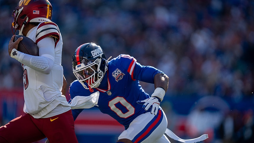 New York Giants linebacker Brian Burns (0) chases down Washington Commanders quarterback Jayden Daniels (5) during a game between the New York Giants and the Washington Commanders at MetLife Stadium in East Rutherford on Sunday, Nov. 3, 2024.