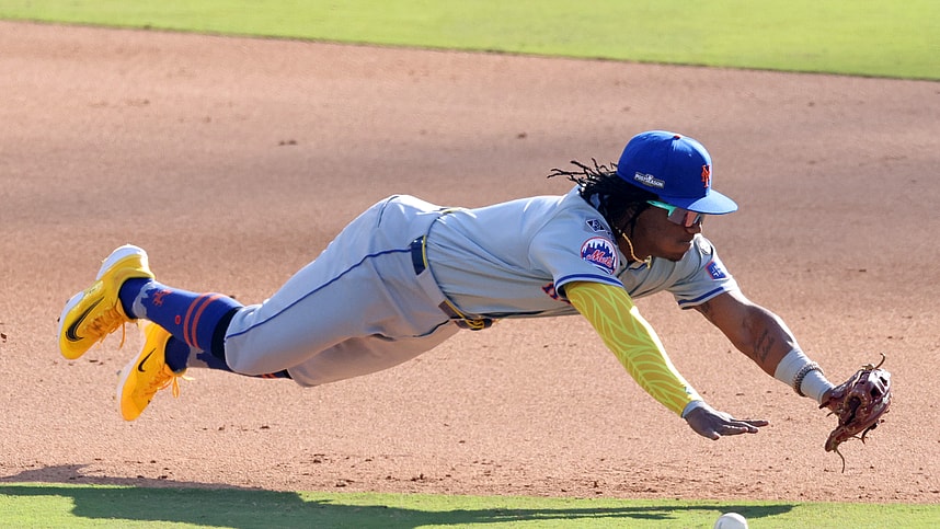 Oct 14, 2024; Los Angeles, California, USA; New York Mets shortstop Luisangel Acuna (2) attempts to field a ground ball against the Los Angeles Dodgers in the eighth inning during game two of the NLCS for the 2024 MLB Playoffs at Dodger Stadium. Mandatory Credit: Jason Parkhurst-Imagn Images