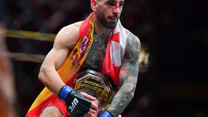 Feb 17, 2024; Anaheim, California, USA; Ilia Topuria celebrates his championship victory against Alexander Volkanovski during UFC 298 at Honda Center. Mandatory Credit: Gary A. Vasquez-Imagn Images