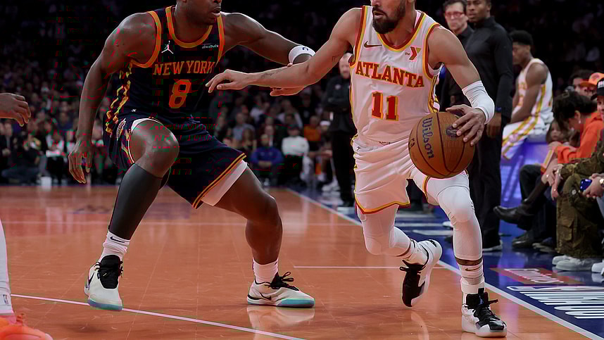 Dec 11, 2024; New York, New York, USA; Atlanta Hawks guard Trae Young (11) controls the ball against New York Knicks forward OG Anunoby (8) during the second quarter at Madison Square Garden. Mandatory Credit: Brad Penner-Imagn Images