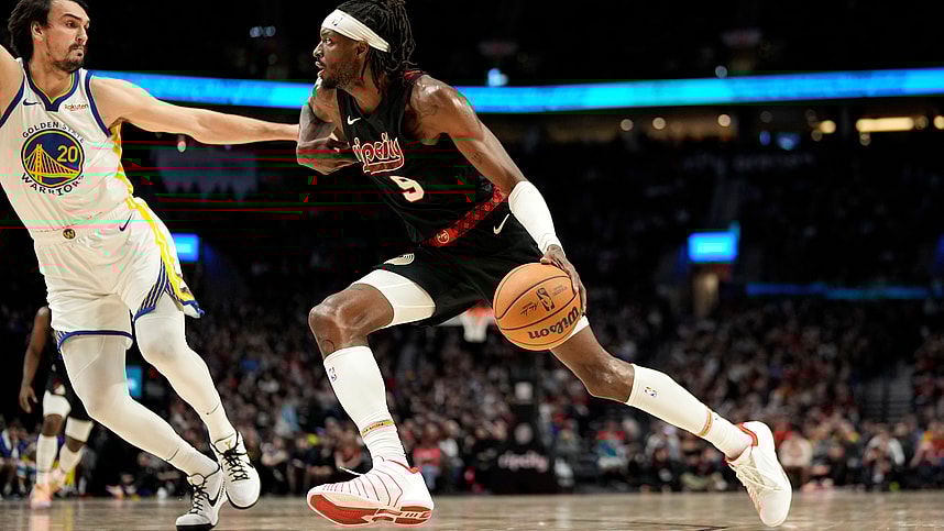 Dec 17, 2023; Portland, Oregon, USA; Portland Trail Blazers small forward Jerami Grant (9) dribbles the ball while defended by Golden State Warriors power forward Dario Saric (20) during the second half at Moda Center. Mandatory Credit: Soobum Im-Imagn Images