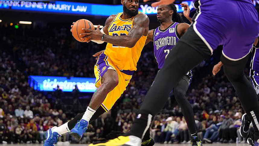 Dec 19, 2024; Sacramento, California, USA; Los Angeles Lakers forward LeBron James (23) drives past Sacramento Kings guard Keon Ellis (23) in the second quarter at the Golden 1 Center. Mandatory Credit: Cary Edmondson-Imagn Images