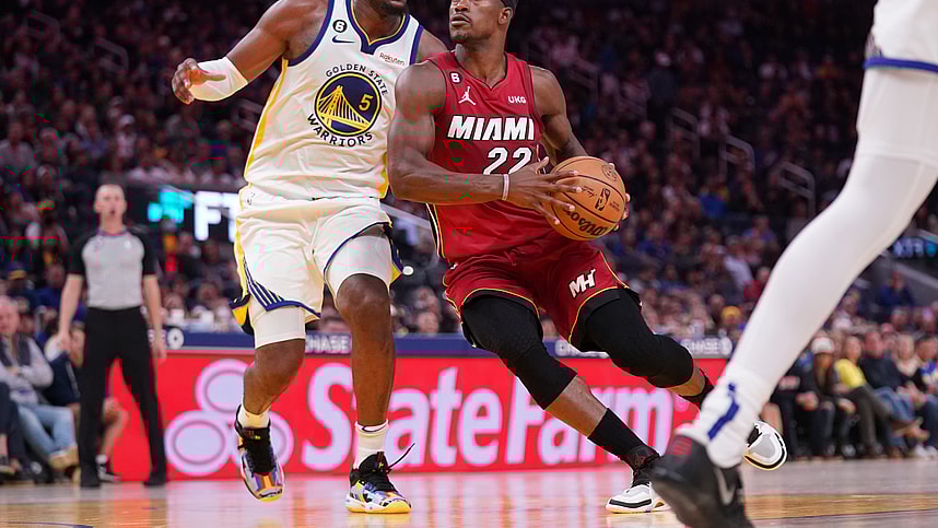 Oct 27, 2022; San Francisco, California, USA; Miami Heat forward Jimmy Butler (22) drives past Golden State Warriors forward Kevon Looney (5) in the fourth quarter at the Chase Center. Mandatory Credit: Cary Edmondson-Imagn Images