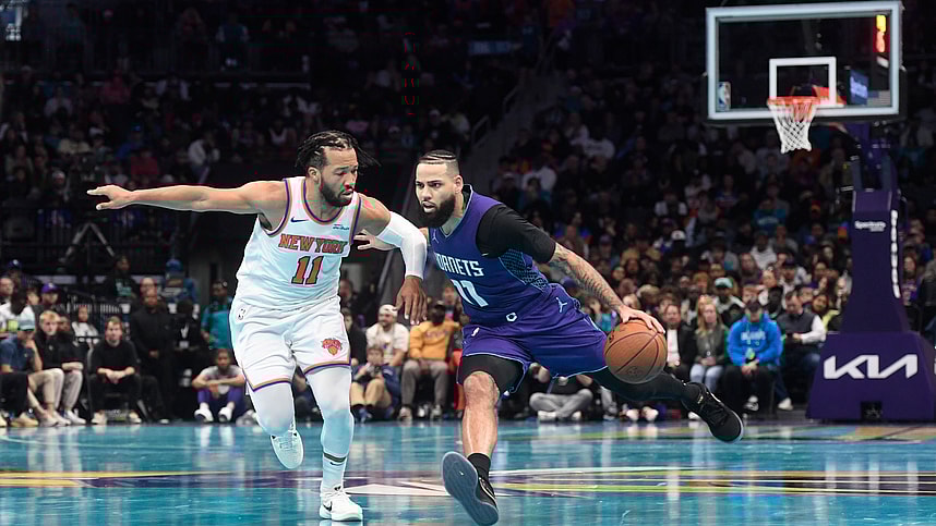 Nov 29, 2024; Charlotte, North Carolina, USA;  Charlotte Hornets forward Cody Martin (11) drives past New York Knicks guard Jalen Brunson (11) during the second half at the Spectrum Center. Mandatory Credit: Sam Sharpe-Imagn Images