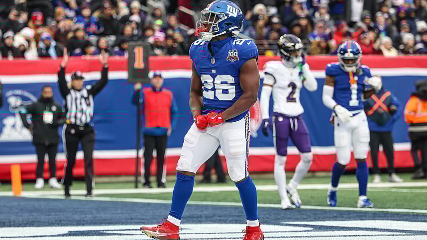 Dec 15, 2024; East Rutherford, New Jersey, USA; New York Giants running back Devin Singletary (26) celebrates after his rushing touchdown during the first half against the Baltimore Ravens at MetLife Stadium. Mandatory Credit: Vincent Carchietta-Imagn Images