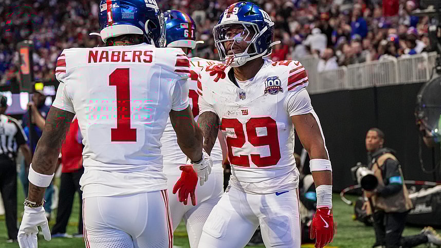 Dec 22, 2024; Atlanta, Georgia, USA; New York Giants running back Tyrone Tracy Jr. (29) reacts with wide receiver Malik Nabers (1) after catching a touchdown pass against the Atlanta Falcons during the first half at Mercedes-Benz Stadium. Mandatory Credit: Dale Zanine-Imagn Images
