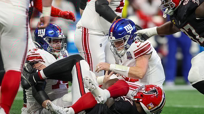 Dec 22, 2024; Atlanta, Georgia, USA; New York Giants quarterback Drew Lock (2) is sacked by Atlanta Falcons linebacker Arnold Ebiketie (17) in the second quarter at Mercedes-Benz Stadium. Mandatory Credit: Brett Davis-Imagn Images
