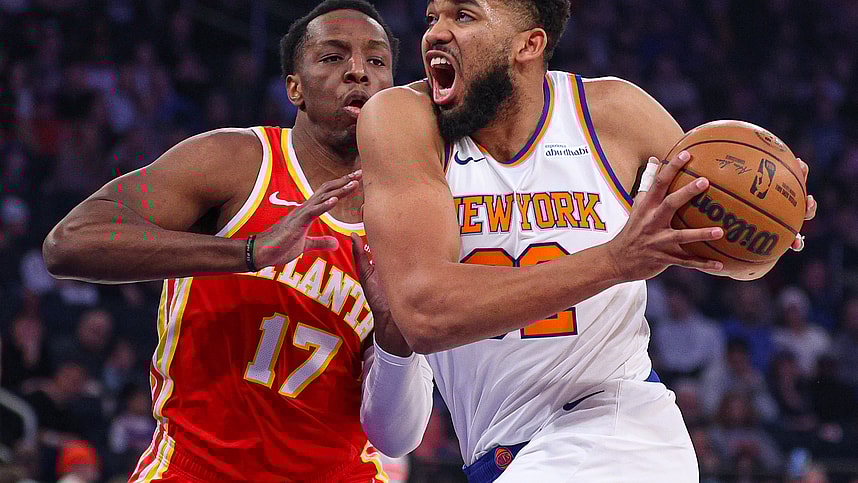 Jan 20, 2025; New York, New York, USA; New York Knicks center Karl-Anthony Towns (32) goes to the basket against Atlanta Hawks forward Onyeka Okongwu (17) during the first half at Madison Square Garden. Mandatory Credit: Vincent Carchietta-Imagn Images