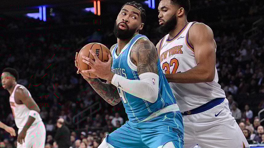 Dec 5, 2024; New York, New York, USA; Charlotte Hornets center Nick Richards (4) posts up against New York Knicks center Karl-Anthony Towns (32) during the first half at Madison Square Garden. Mandatory Credit: John Jones-Imagn Images
