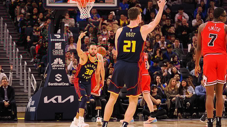 Jan 23, 2025; San Francisco, California, USA; Golden State Warriors center Quinten Post (21) celebrates with guard Stephen Curry (30) after scoring a three point basket against the Chicago Bulls during the fourth quarter at Chase Center. Mandatory Credit: Kelley L Cox-Imagn Images