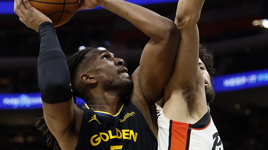 Jan 9, 2025; Detroit, Michigan, USA;  Golden State Warriors forward Kevon Looney (5) shoots against Detroit Pistons guard Cade Cunningham (2) in the second half at Little Caesars Arena. Mandatory Credit: Rick Osentoski-Imagn Images