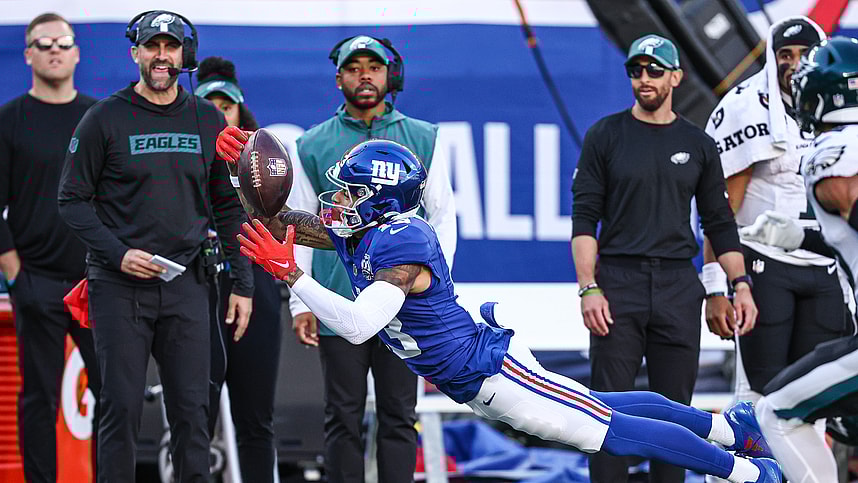Oct 20, 2024; East Rutherford, New Jersey, USA; New York Giants wide receiver Jalin Hyatt (13) attempts to catch a pass in front of Philadelphia Eagles safety Tristin McCollum (36) during the second half at MetLife Stadium. Mandatory Credit: Vincent Carchietta-Imagn Images