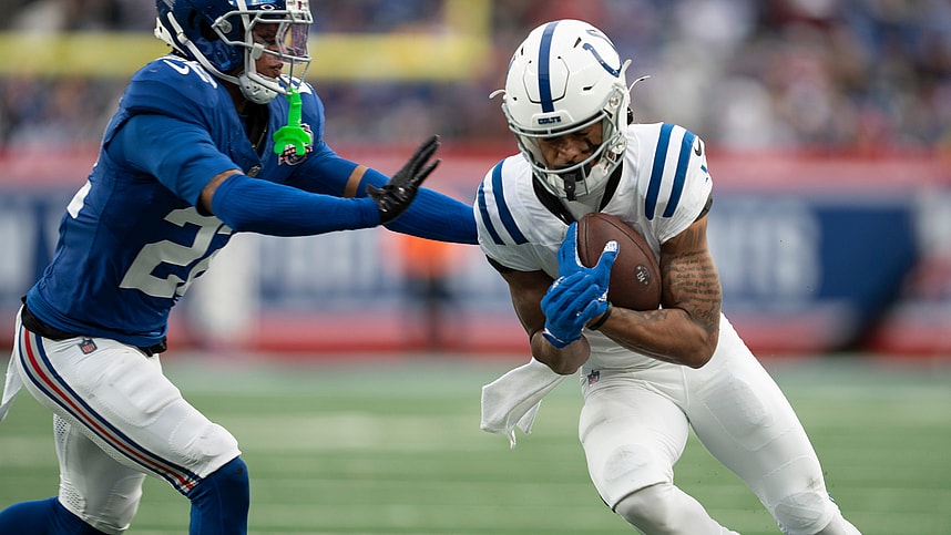 Indianapolis Colts wide receiver Josh Downs (1) runs with the ball before being pushed out of bounds by New York Giants cornerback Dru Phillips (22) during a game between New York Giants and Indianapolis Colts at MetLife Stadium on Sunday, Dec. 29, 2024.