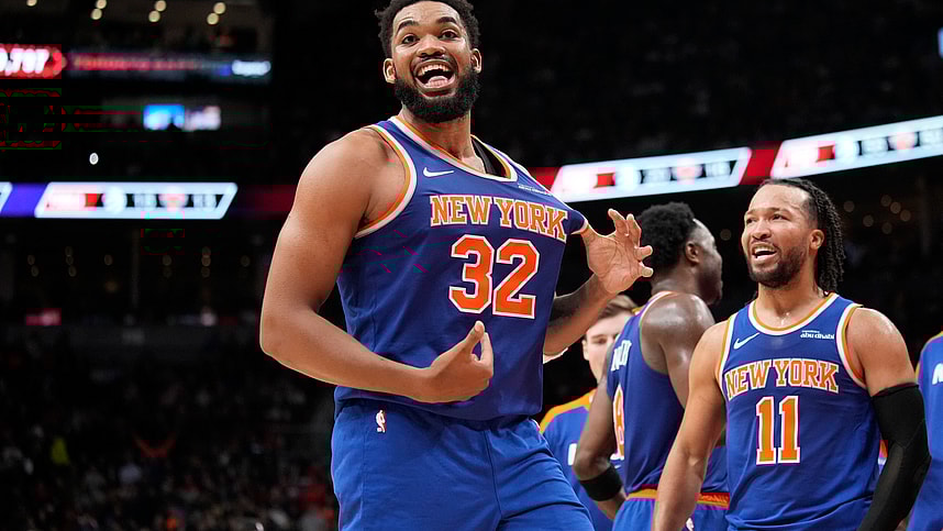 Dec 9, 2024; Toronto, Ontario, CAN; New York Knicks guard Jalen Brunson (11) watches as center Karl-Anthony Towns (32) celebrates after making a three point basket to clinch a win against the Toronto Raptors near the end of the fourth quarter at Scotiabank Arena. Mandatory Credit: John E. Sokolowski-Imagn Images